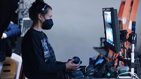 Dp Eve Cohen behind the scenes looking at playback on director’s monitor