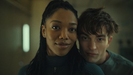 “Mickey 17”: Mickey (Robert Pattinson) with his love interest Nasha (Naomi Ackie).