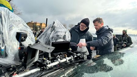 Behind the scenes of “The Amateur”: Martin Ruhe ASC (left) and 1st AC Tobias Eedy (right) check over a two-camera car rig used while filming in Istanbul.