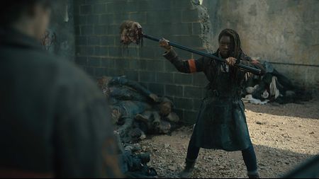 Actress Danai Gurira ready to attack and cuts off zombie head